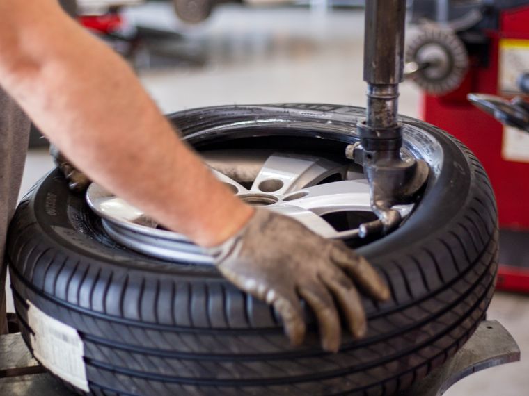 Tire being mounted on a wheel at the shop